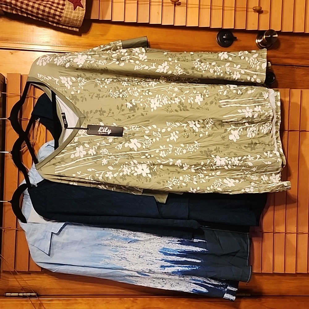 3 plus size shirts, the first one is a 5X,  the other two are 4X.